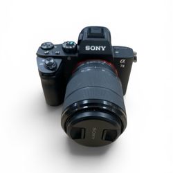Sony Alpha a7 III mirrorless digital camera equipped with a 28-70mm lens