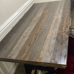 This Is A Family Dinner Table With Five Chairs