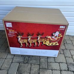 HOME DEPOT - Santa's Sleigh with Reindeer Holiday Yard Decoration - Home Accents Holiday 9 ft. Giant-Sized LED 