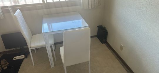 White dining table with 2 set of chair.