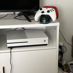 X Box One And 2 Controllers