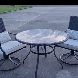 Dark Gray Wicker Table & Two Swivel Chairs