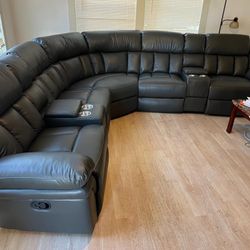 New Reclining Sectional .  Grey Gel Leatherette .  122” X 122”.  Free Delivery !