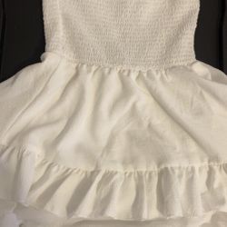 A strapless mini dress with a smocked bodice and layered ruffle hem 