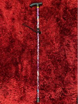 Brand new adjustable floral cane.