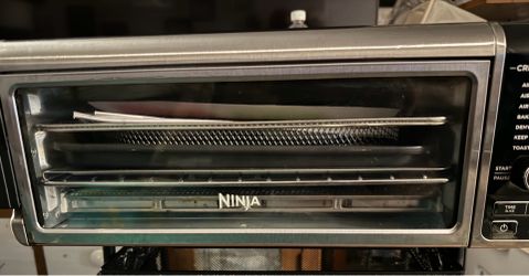 Ninja air fryer in mint condition with booklets asking 180
