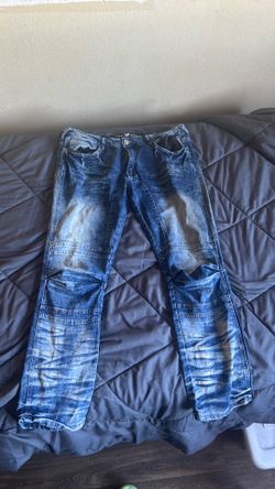 Men’s faded blue jeans