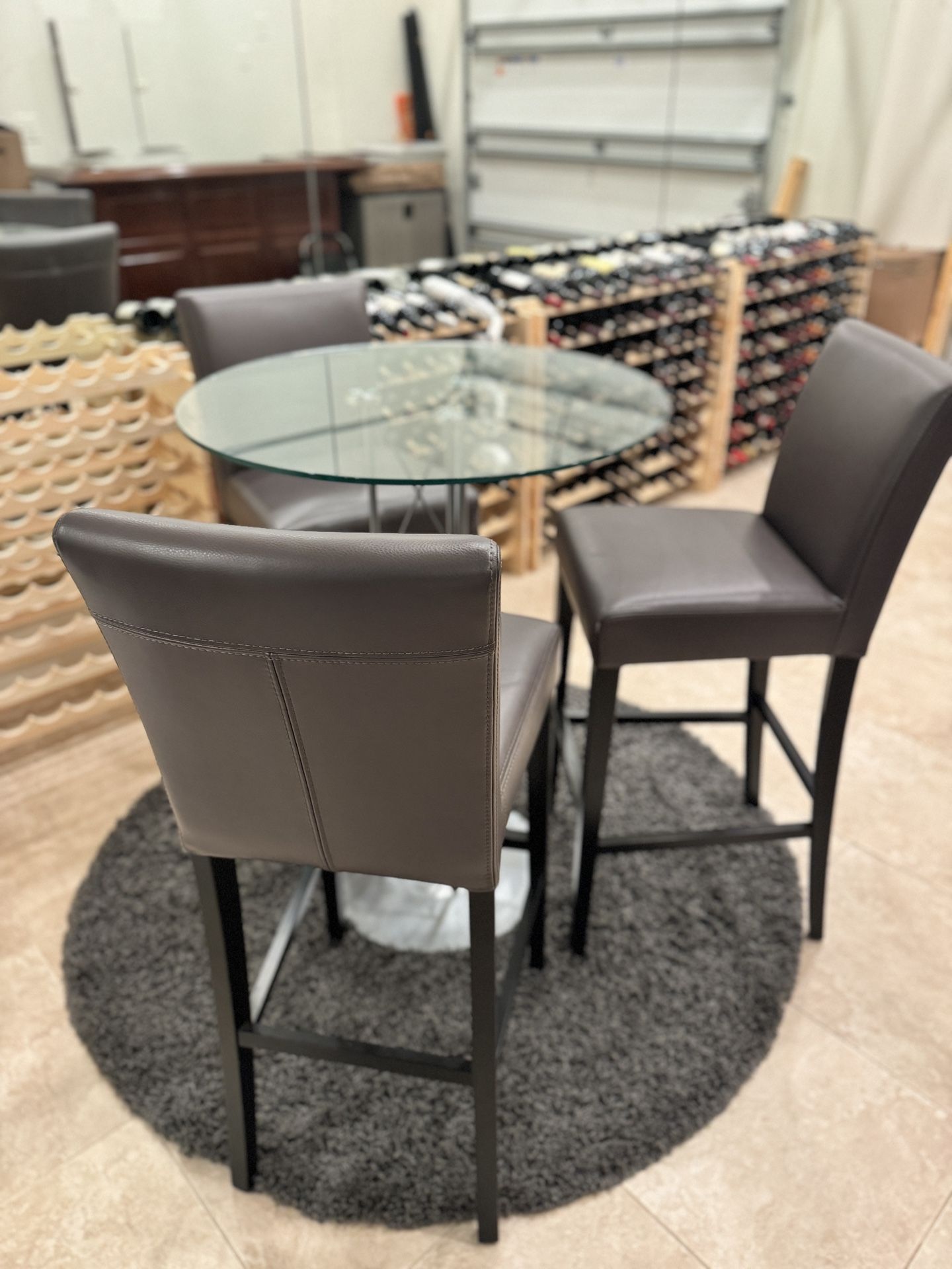 Round Glass High top Table, Shag Rug & 3 Leather Crate And Barrel Stools