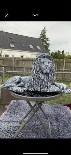 Stone colored lion statue