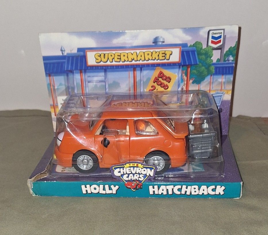 Chevron Cars 1997 Vintage Holly Hatchback Orange Toy + Dog in Shopping Cart - NIB