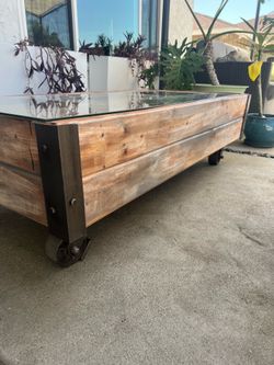 Homemade coffee table, removable glass top, iron wheels, Industrial Style, heavy.
