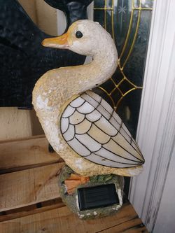 Outdoor garden statue of duck