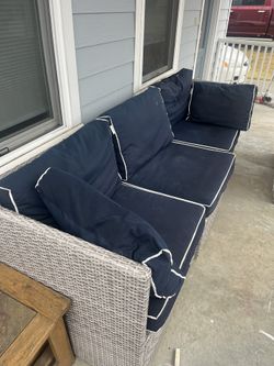 Wicker Couch With Navy Cushions