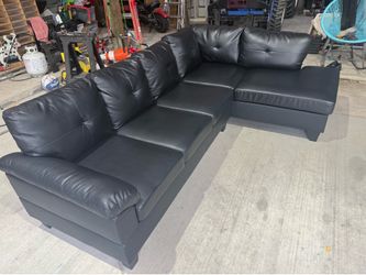 100 inch wide faux leather right hand facing sofa and chaise