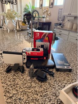 Switch Oled bundled with two carrying cases