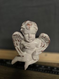 White Porcelain Cherub Angel Figurine with Reddish-Brown Accents