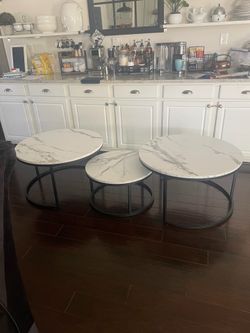 Set of 3 coffee tables, black with faux marble top.