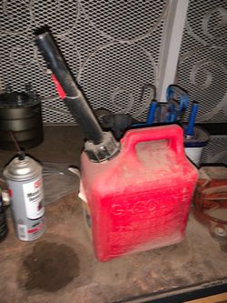 Red and Black canister gas can gasoline