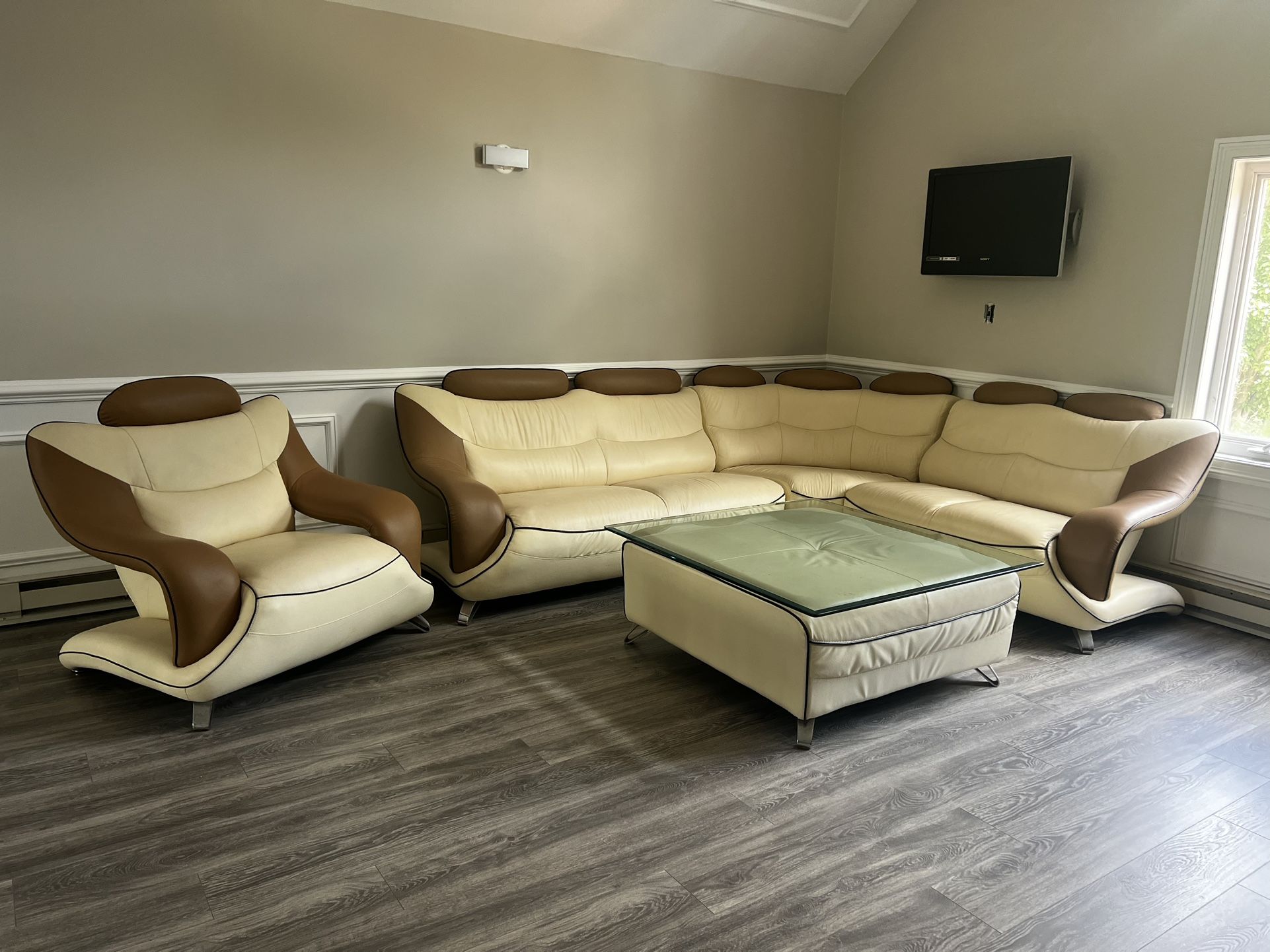 Leather Sectional Cream And Taupe With Matching Ottoman ( Custom Glass To Use As A Cocktail Table) And Matching Chair