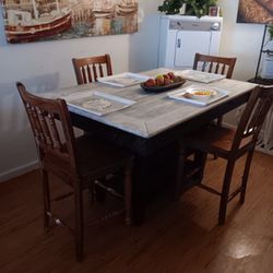 Kitchen table With wine rack and table drawers.