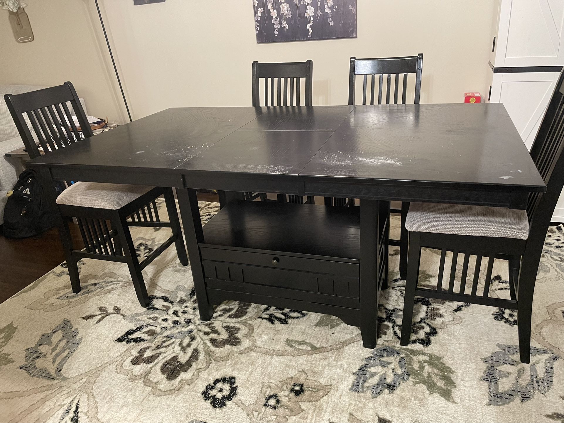 Dining room bar height table with 6 chairs and buffet server