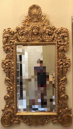 Vintage ornate gold mirror