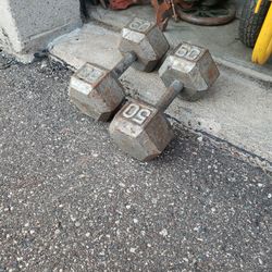 set of 50 pound dumb Bells
