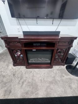 Cherry wood fire place entertainment center