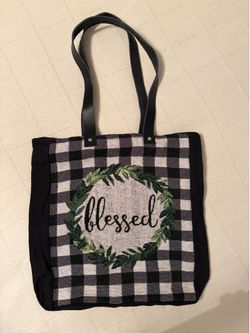 Tote bag. Black & white gingham with a green wreath and “Bllessed” on it.