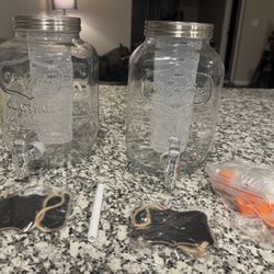 Selling a set of two (2) 1-gallon glass drink dispensers, perfect for parties, gatherings, holidays, BBQs, and events. Brand new, Only Used Once. 