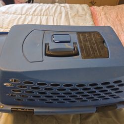 blue and black hard-sided pet carrier or kennel.