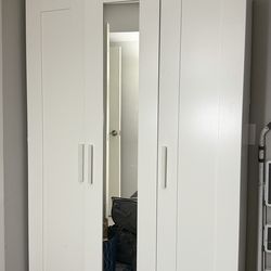 White Closet wardrobe with hangers and shelves