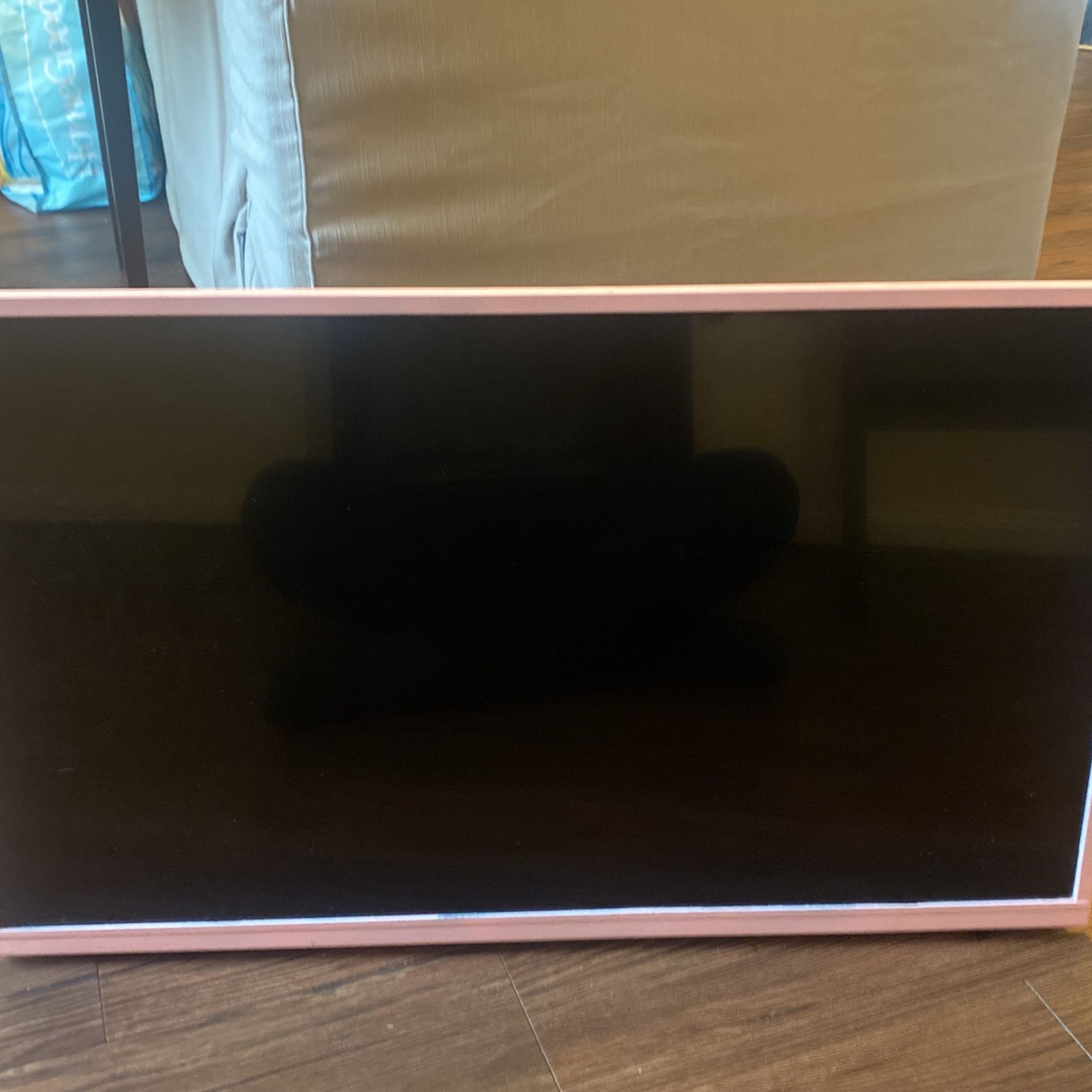 TCL 32S331 Roku TV (pink frame)