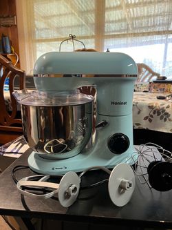Honinst 6.5-quart (approx. 6.1-liter) electric stand mixer; lightweight, tilt-head design with 10 speeds plus a pulse function. Includes a dough hook,