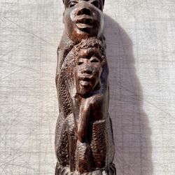 African Wooden Sculpture With Multiple Faces