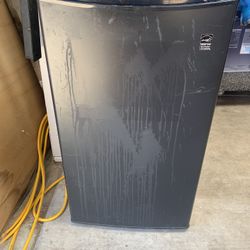Small black refrigerator in good condition 