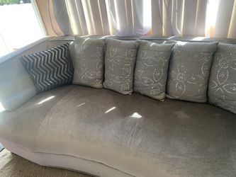 Light Grey Couch with 5 grey pillows and 2 black silver design pillows ( IKEA brand)