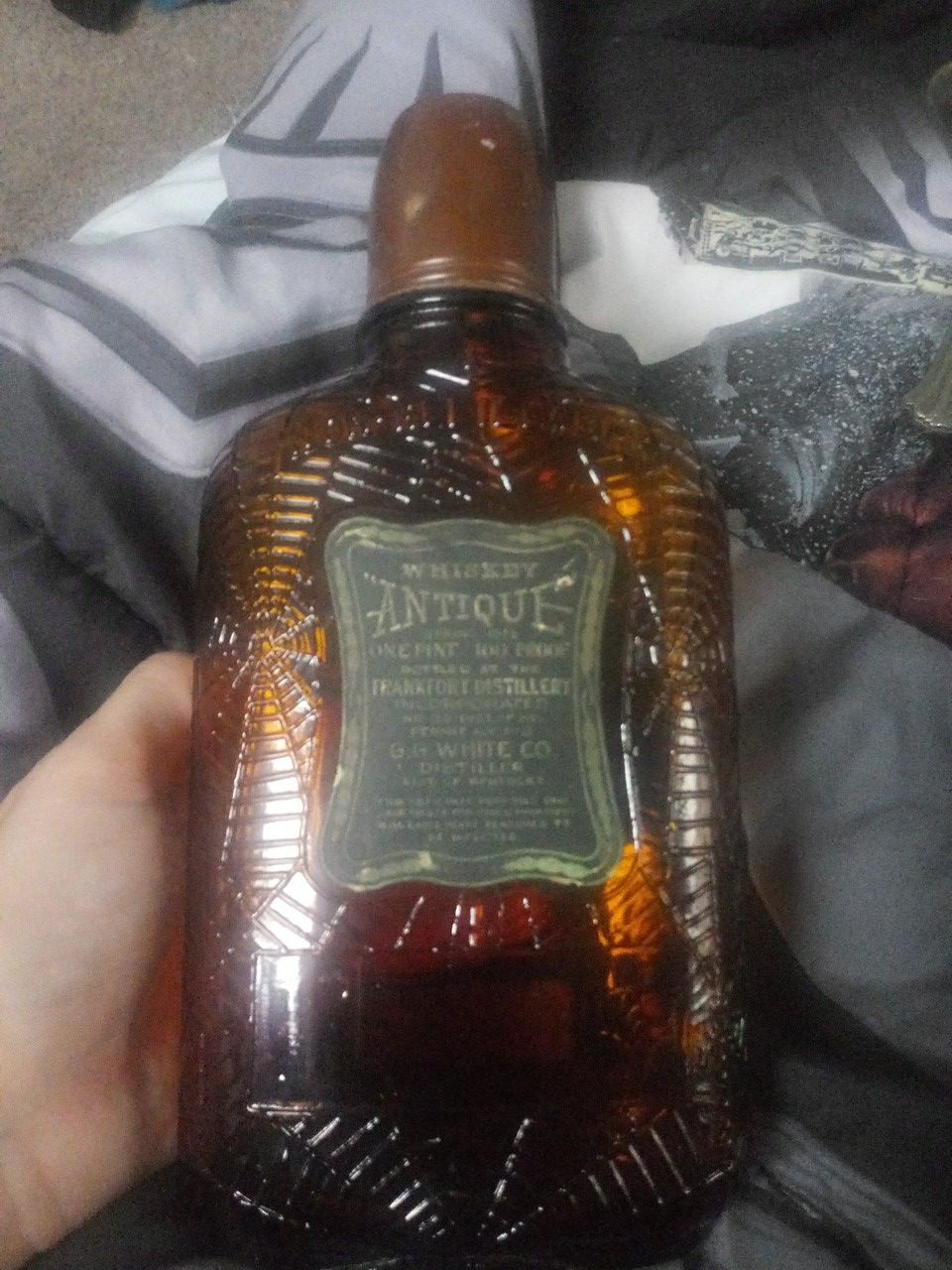 Antique whiskey spiderweb bottle in excellent condition