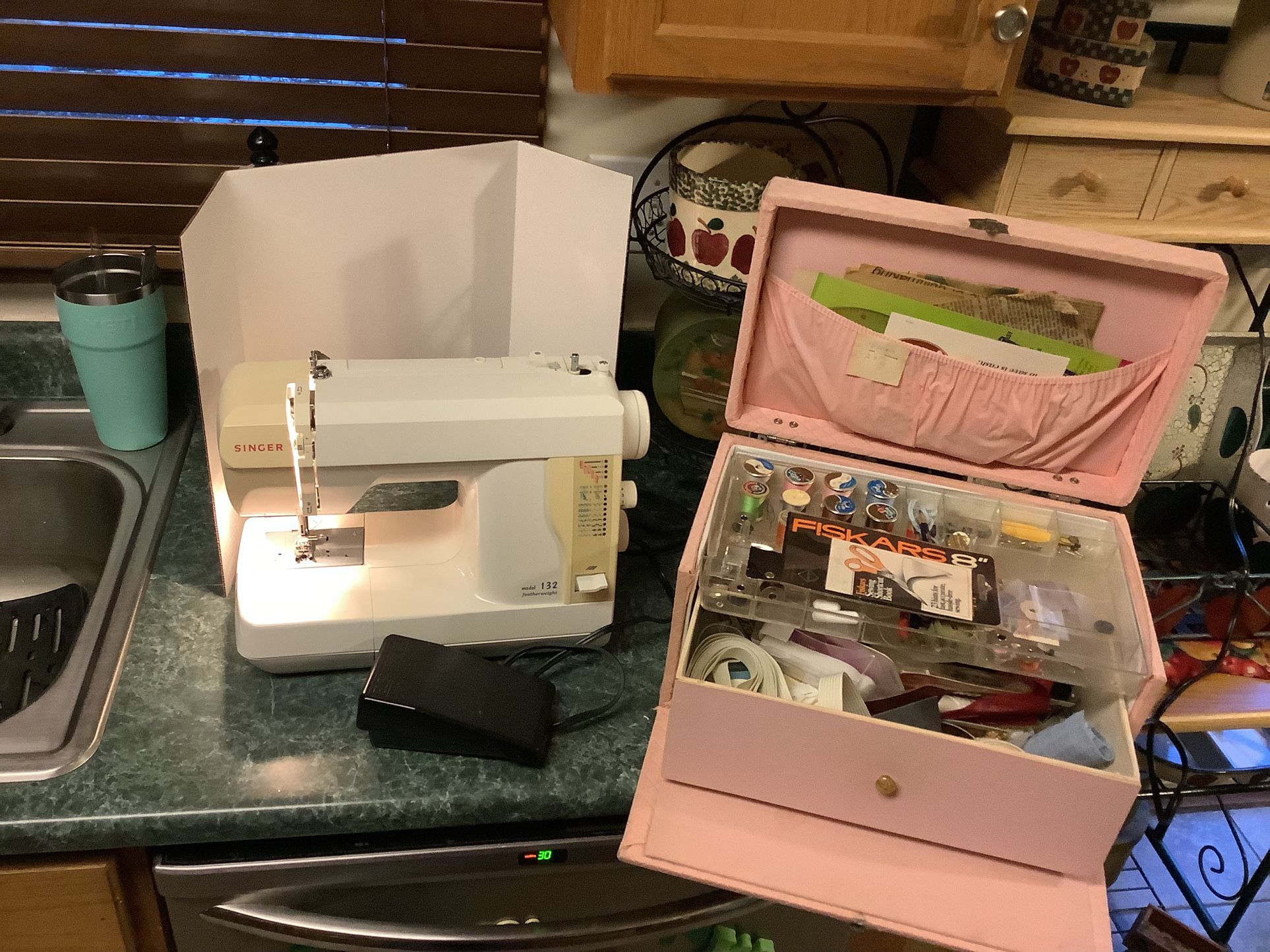 Singer 132 Featherweight iconic sewing machine in like new condition. Foot pedal/cord and grandma's complete sewing case with over 300 pieces. Clean a