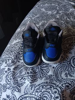 Black and blue nike shoes