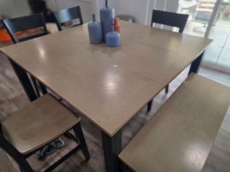 Wood Dining room table with 4 chairs and a bench with storage