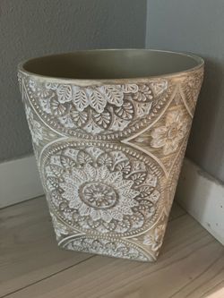 Carved wastebasket