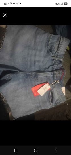 Lucky Brand Women's 90s Midi Shorts in a light wash blue denim