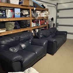 Navy blue leather couch and love seat