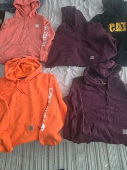 Carhartt sweaters Carhart and Cat hoodies size large and large $15 each . LocatedGriffin , Georgia