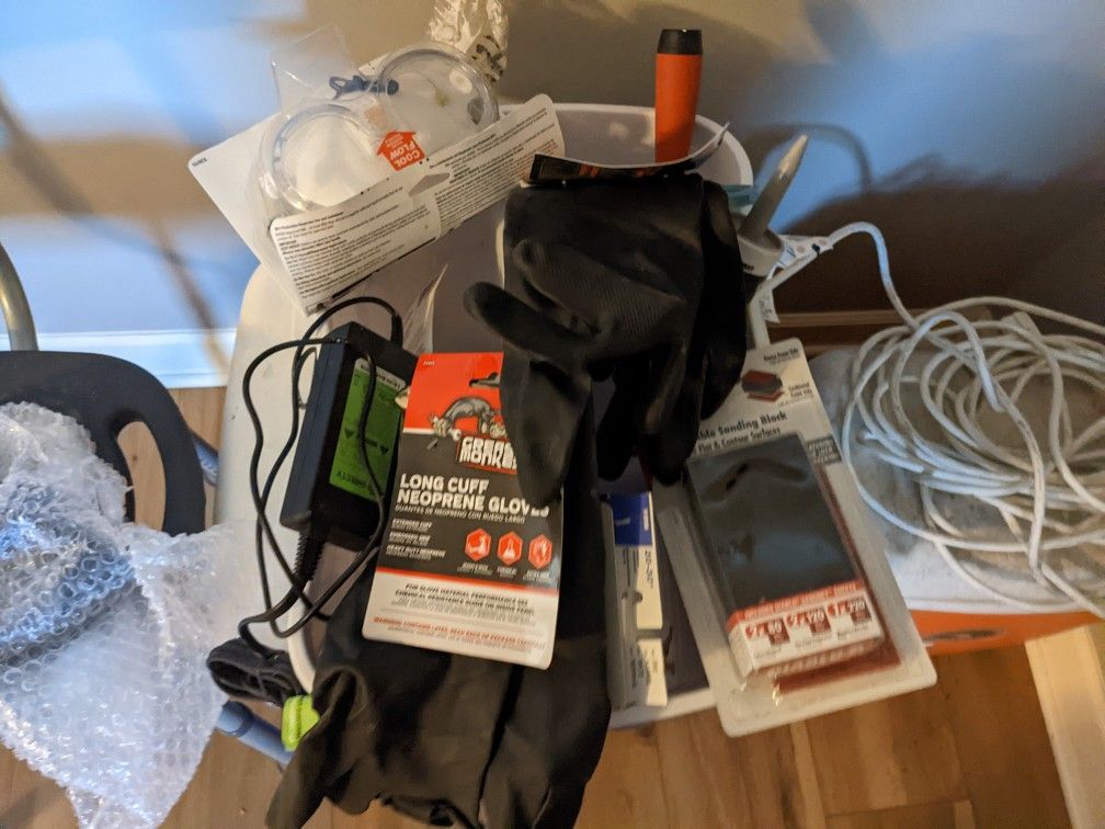 2 Igloo Coolers.  2 Pair New Rubber Gloves .Extension Cord. Other Stuff 