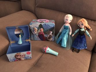 Frozen set- musical jewelry box, 2 dolls, puzzle, and spinning light toy