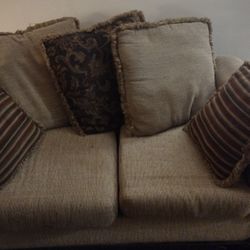 Love seat,Light Brown,Some cushions with a wine-colored print, cushions and an additional cover 