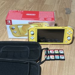 Nintendo switch Lite yellow .bundle + 8 games +case . And excellent condition