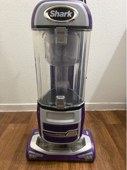 Shark Navigator Powered Lift-Away DLX upright vacuum in a purple and silver color scheme